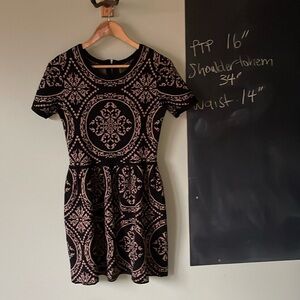 Gorgeous, medallion sweater dress by Romeo & Juliet couture